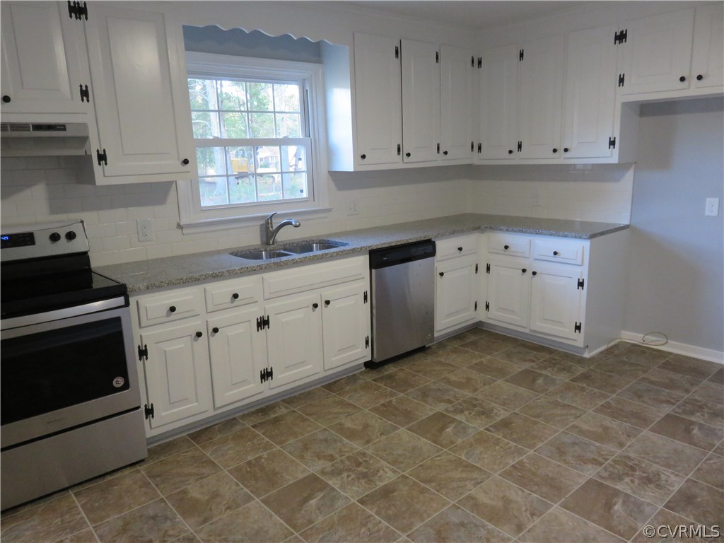8573 Strath Road Henrico, VA 23231 - Photo 19 of 37 a kitchen with white cabinets and sink