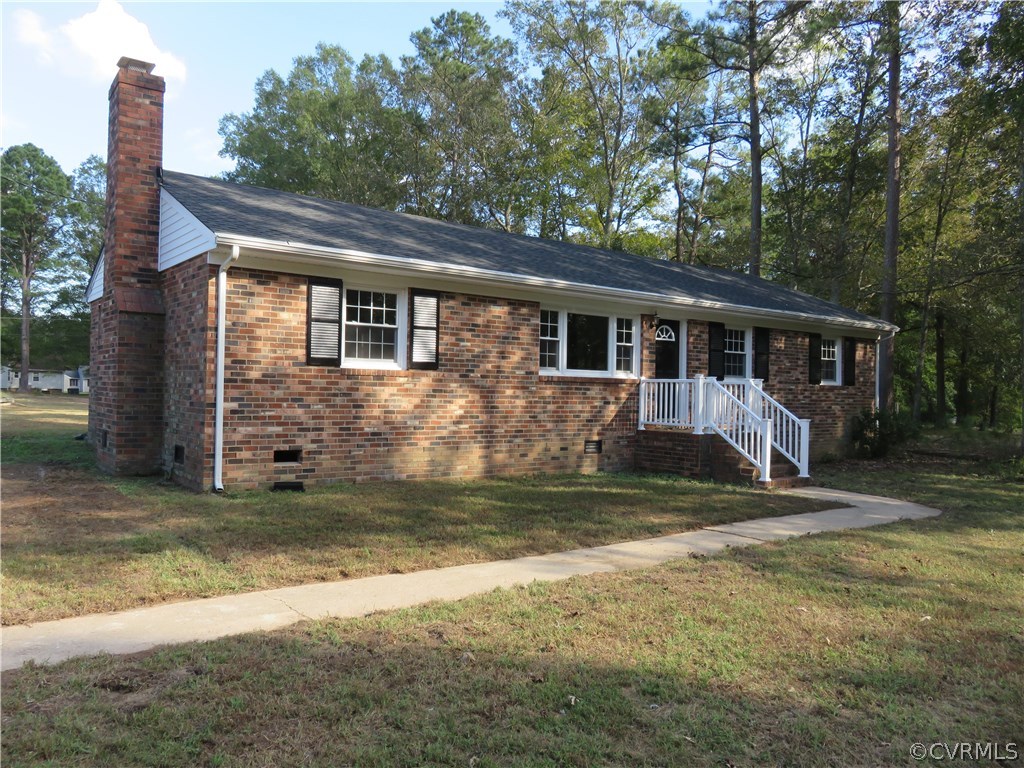 8573 Strath Road Henrico, VA 23231 - Photo 4 of 37 a view of a house with backyard and sitting area
