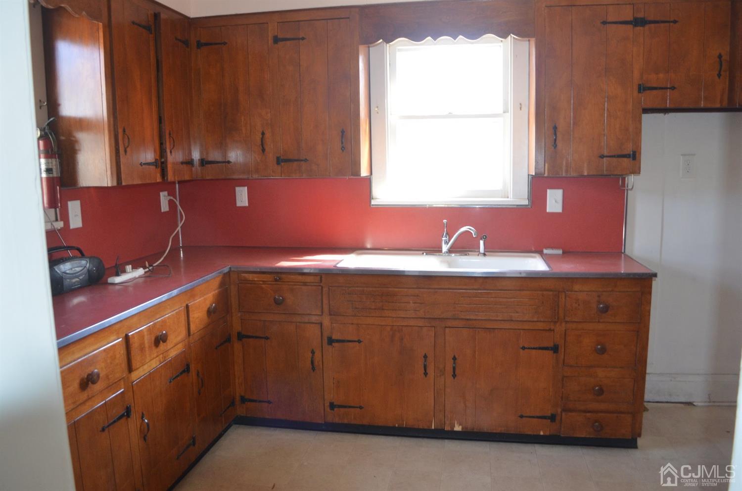 75 West Hill Road Colonia, NJ 07067 - Photo 11 of 35 a bathroom with a sink and a window