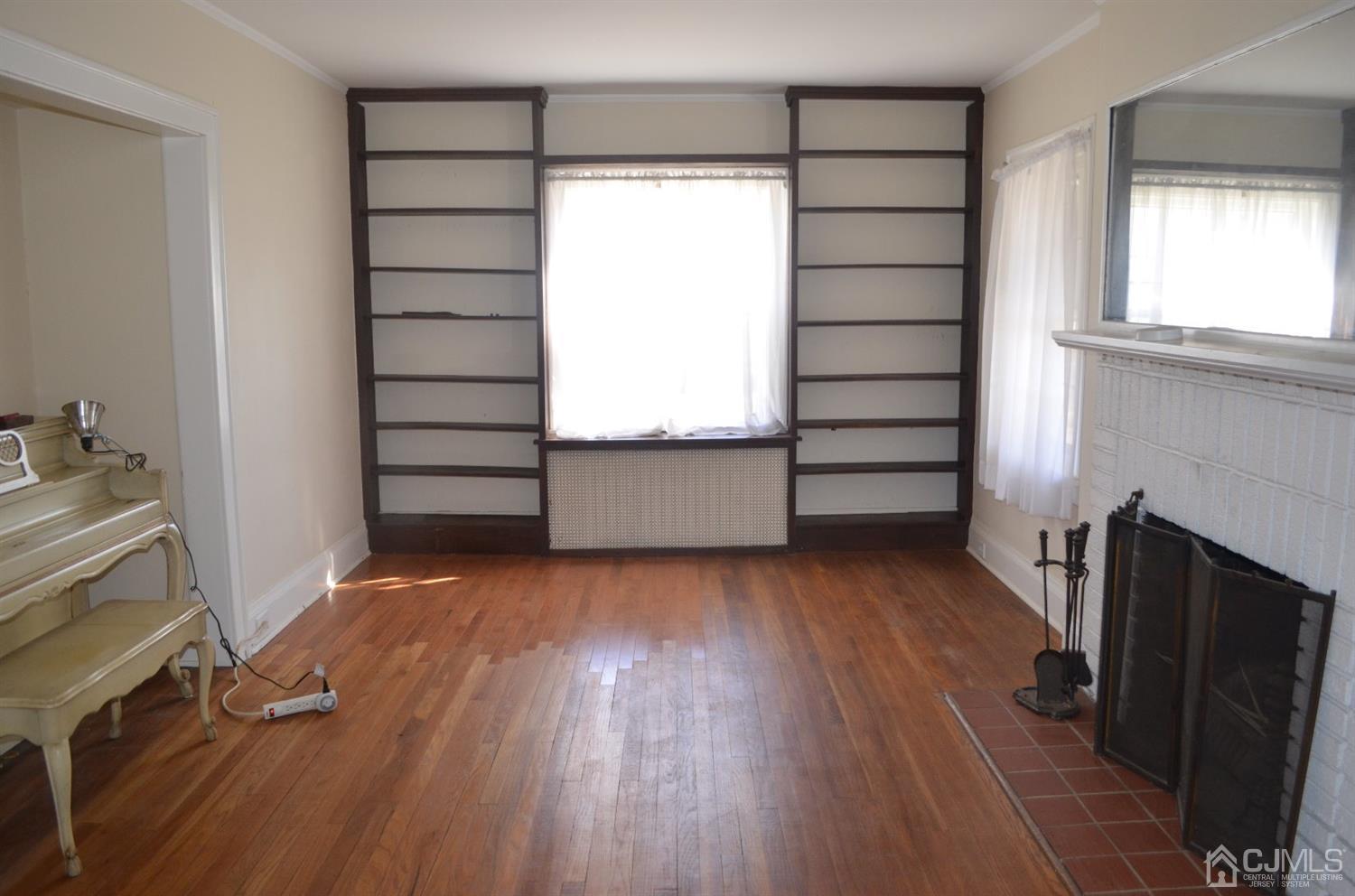 75 West Hill Road Colonia, NJ 07067 - Photo 17 of 35 a view of empty room with wooden floor and fan