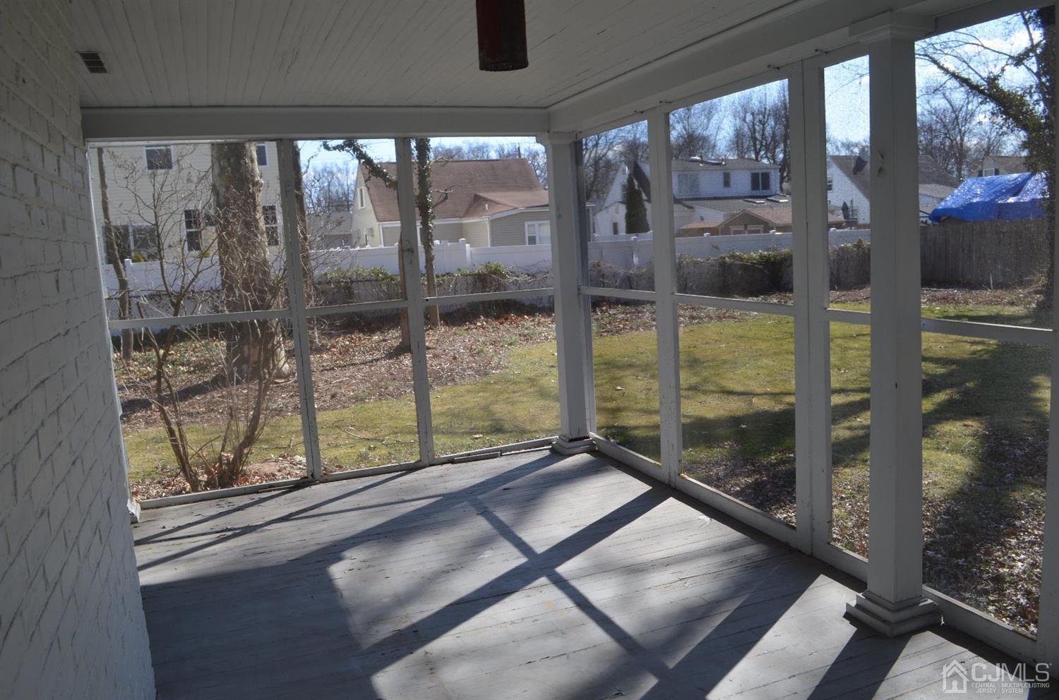 75 West Hill Road Colonia, NJ 07067 - Photo 22 of 35 a view of a glass door with a yard from a window