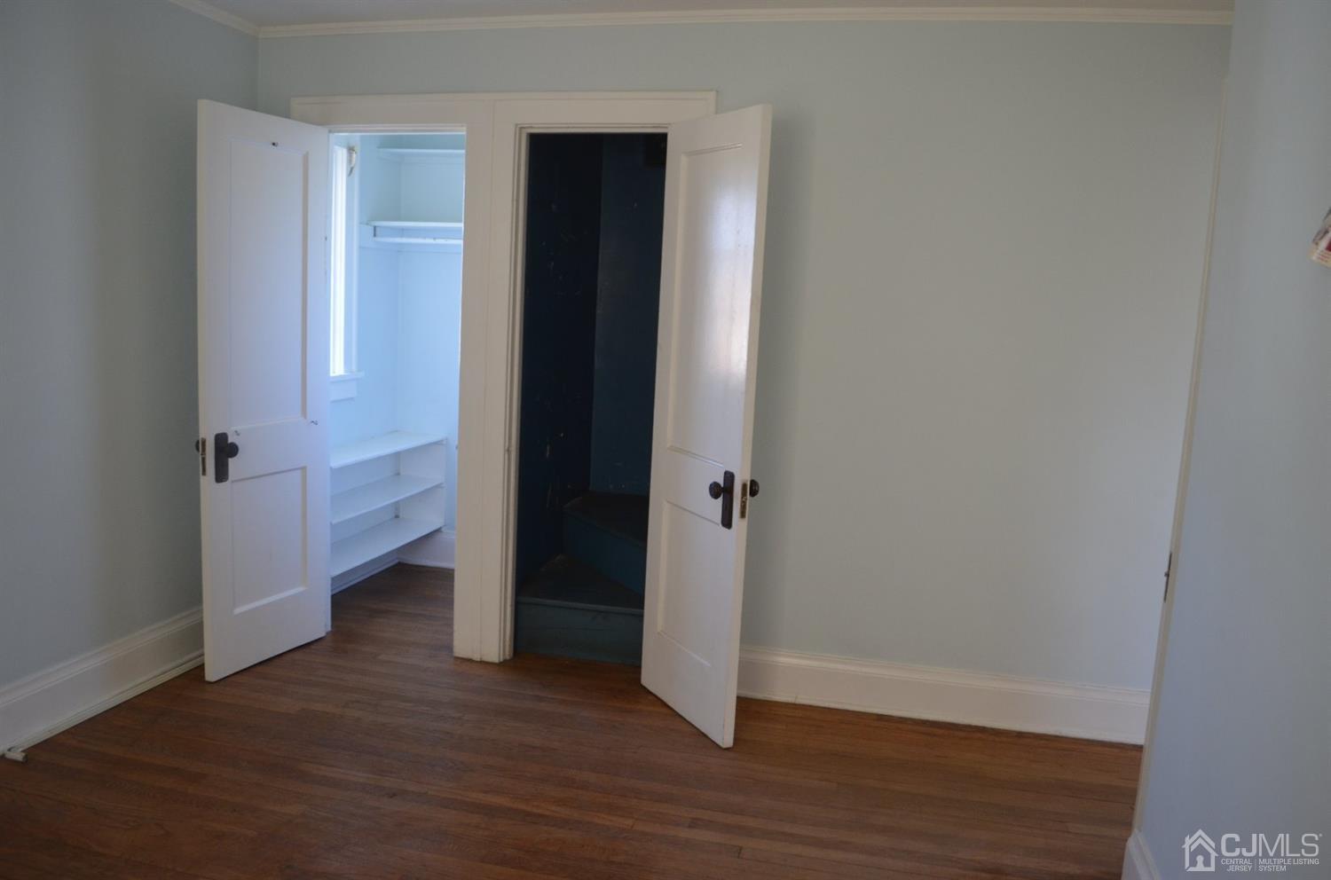 75 West Hill Road Colonia, NJ 07067 - Photo 24 of 35 a view of a hallway with wooden floor