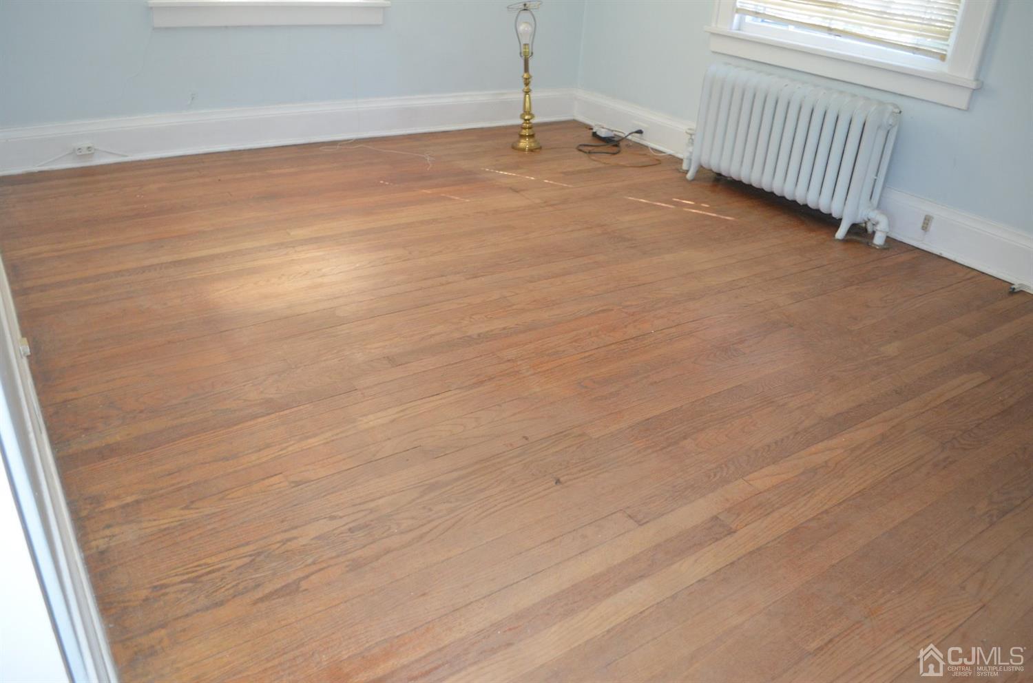 75 West Hill Road Colonia, NJ 07067 - Photo 26 of 35 a view of a livingroom with wooden floor and window