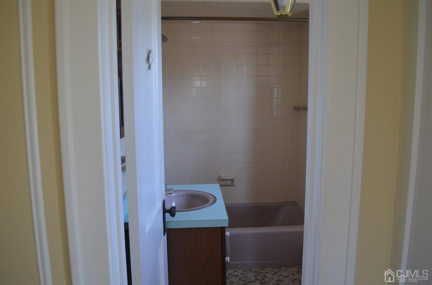 75 West Hill Road Colonia, NJ 07067 - Photo 27 of 35 a bathroom with a shower and toilet