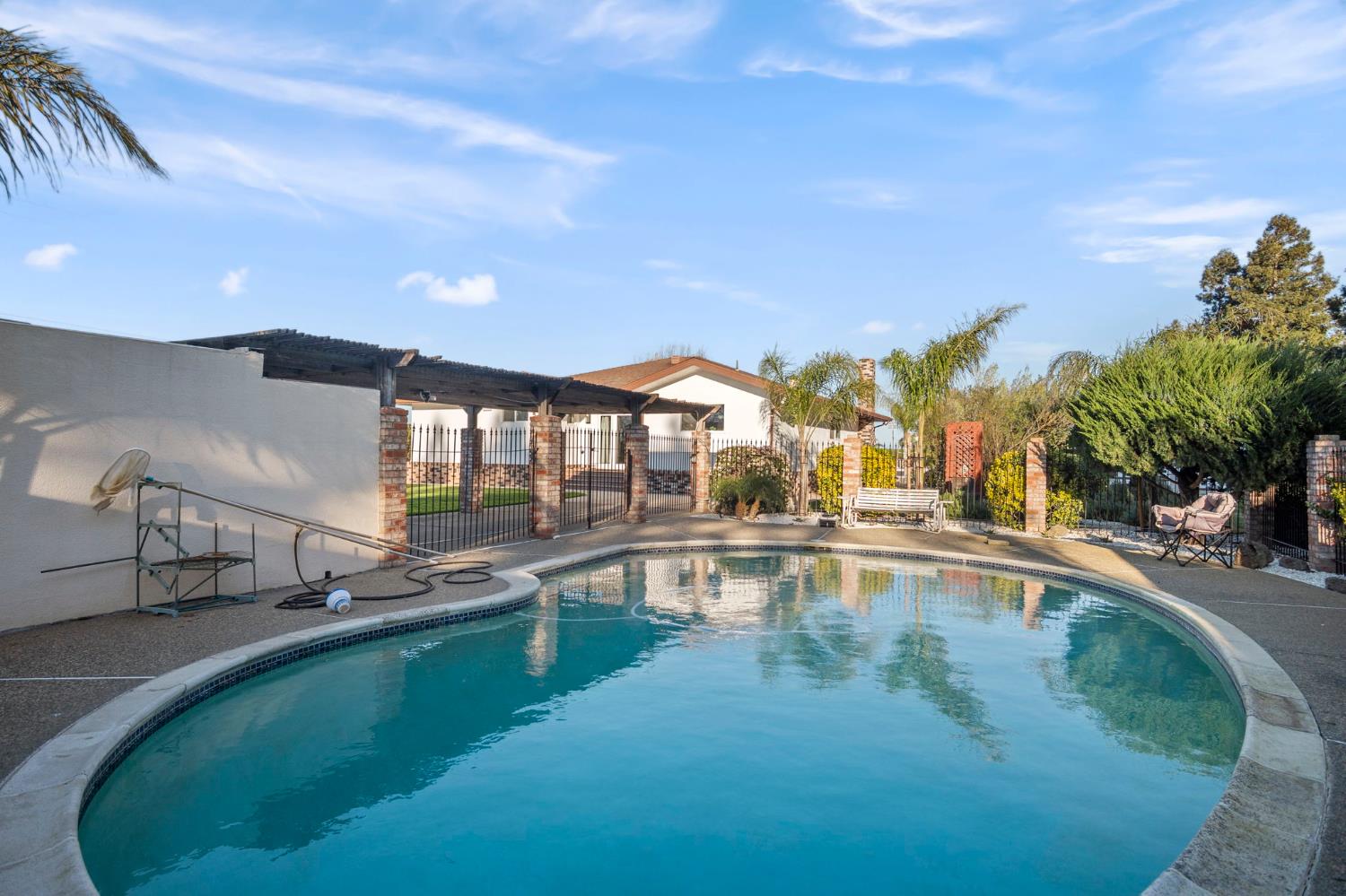 20201 Dustin Road Acampo, CA 95220 - Photo 17 of 23 a view of a swimming pool with outdoor seating