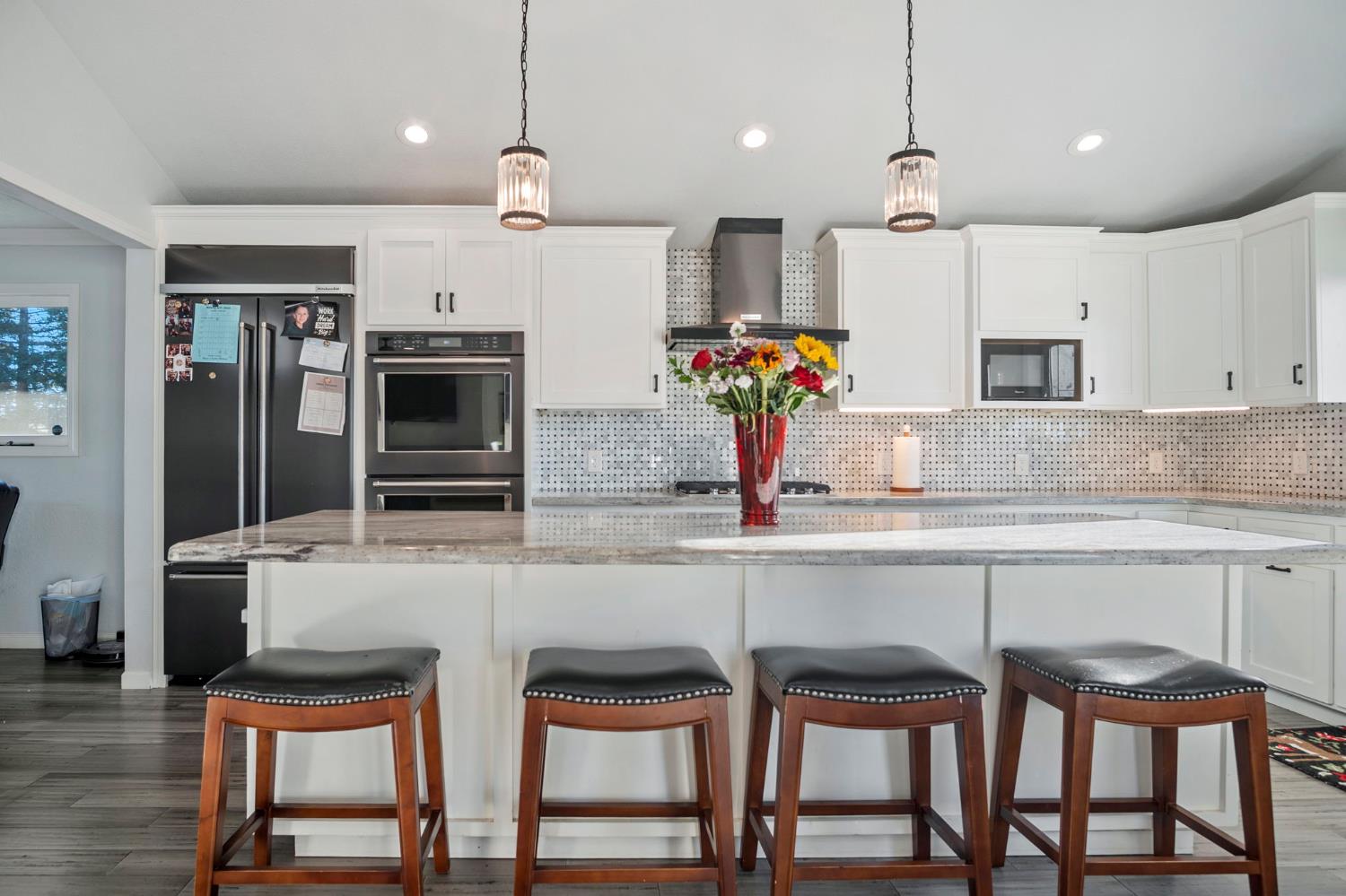 20201 Dustin Road Acampo, CA 95220 - Photo 7 of 23 a kitchen with stainless steel appliances granite countertop a stove top oven a sink and white cabinets