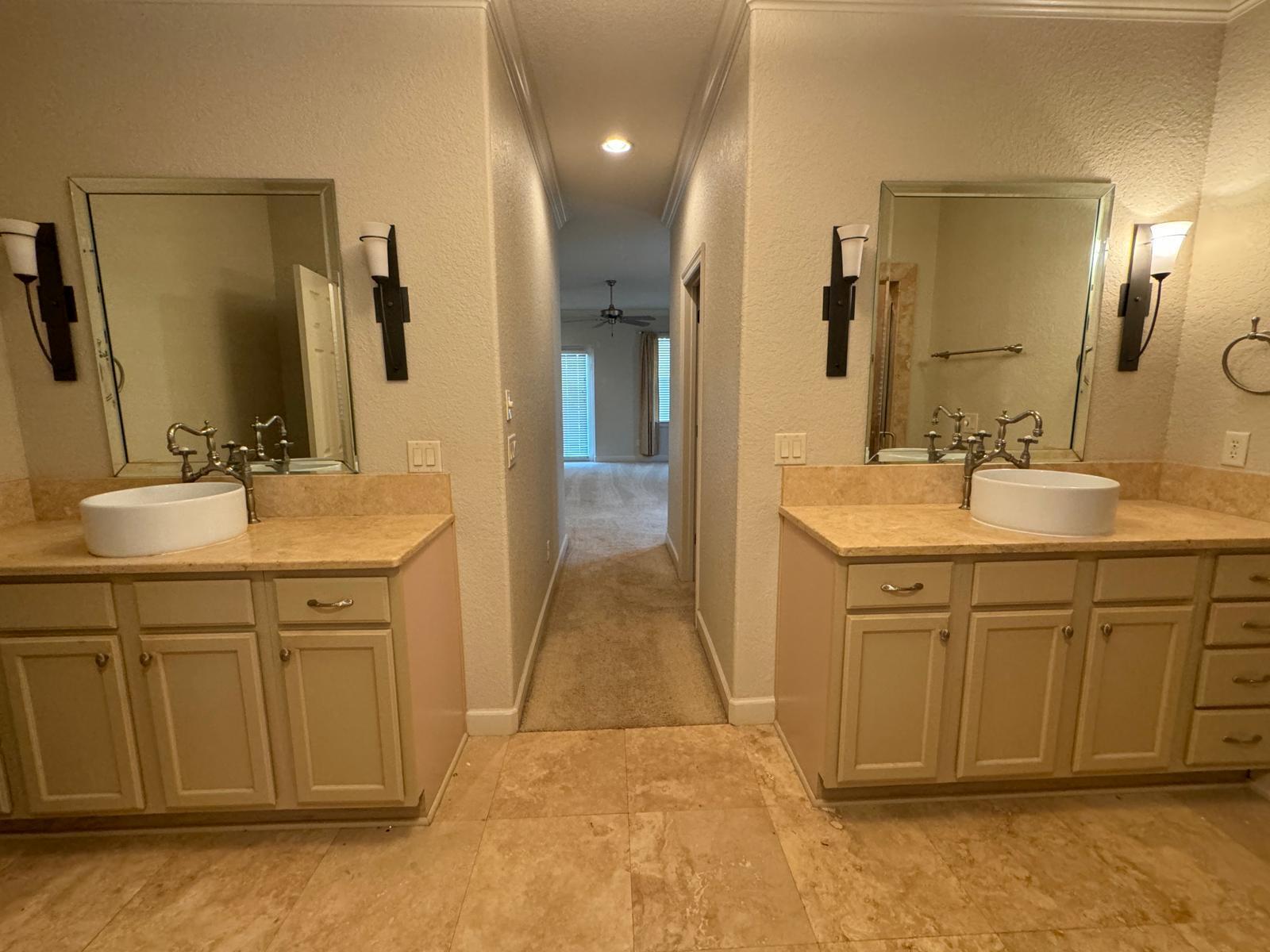 241 Inverrary Drive Destin, FL 32541 - Photo 13 of 24 a bathroom with a sink a vanity and a mirror