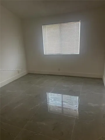 an empty room with window