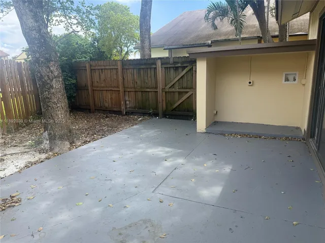 a view of backyard and entertaining space