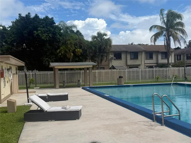 a view of a patio with swimming pool