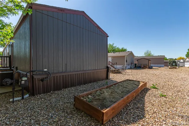 a view of a backyard with sitting area