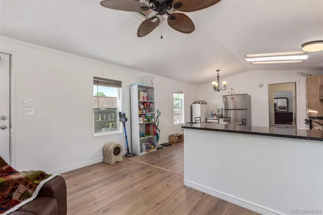 a view of a livingroom with furniture and a workspace