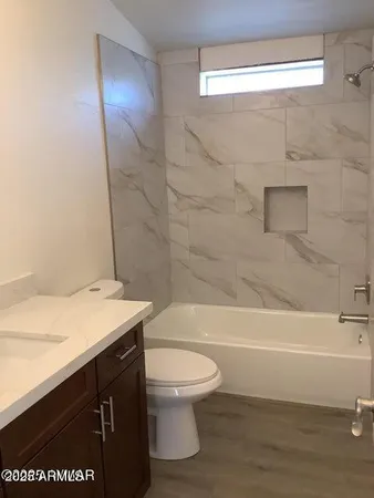 a bathroom with a sink a toilet and a bathtub
