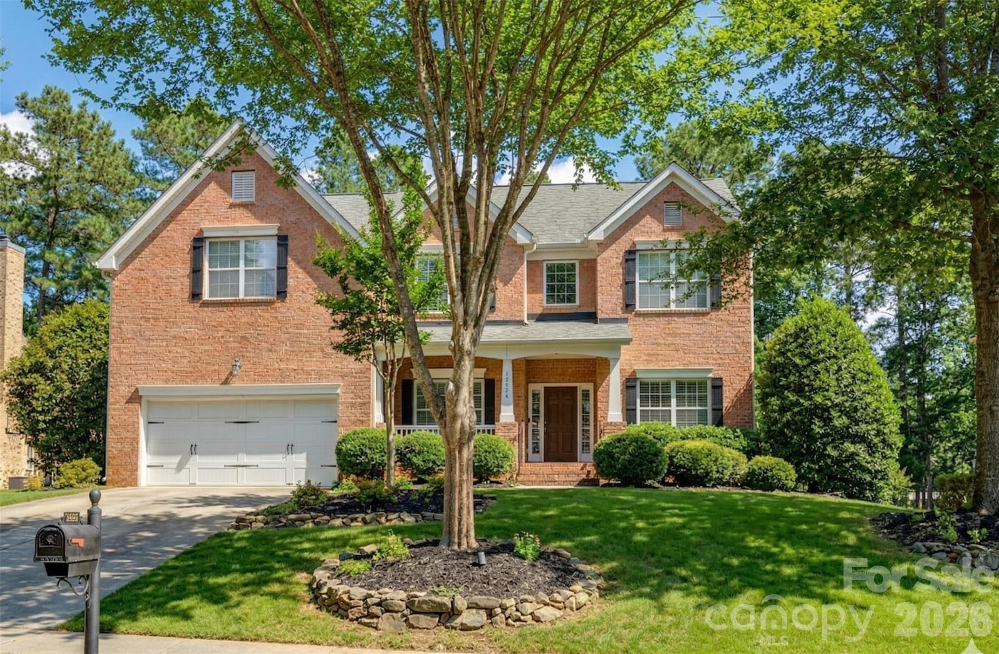 16624 Turtle Point Road Charlotte, NC 28278 - Photo 1 of 46 a front view of a house with a yard and garage