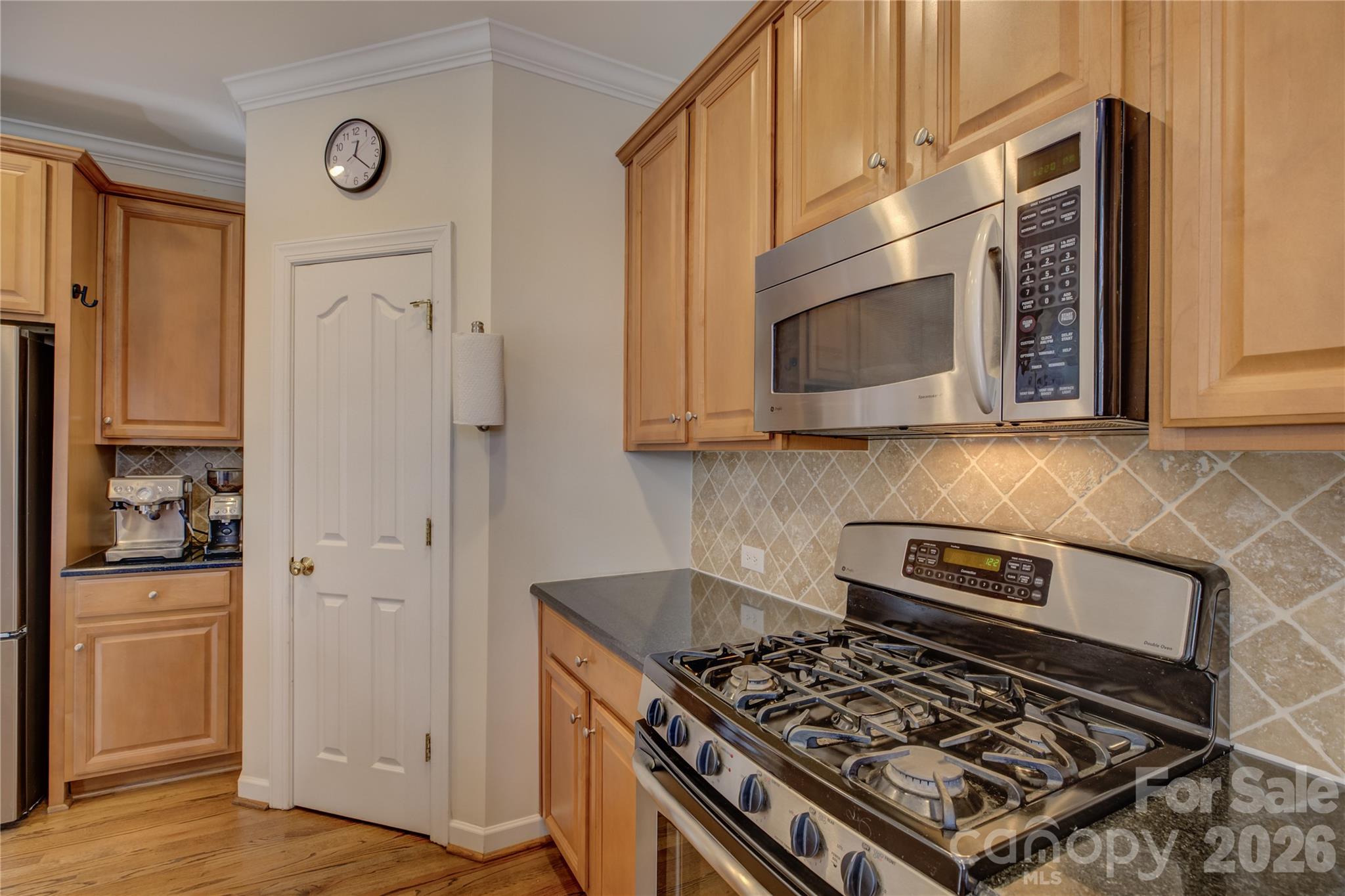 16624 Turtle Point Road Charlotte, NC 28278 - Photo 14 of 46 a kitchen with stainless steel appliances granite countertop a stove and a microwave