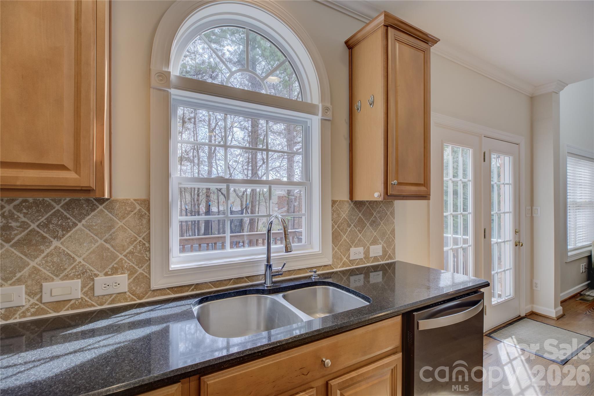 16624 Turtle Point Road Charlotte, NC 28278 - Photo 15 of 46 a kitchen with granite countertop a sink and a window