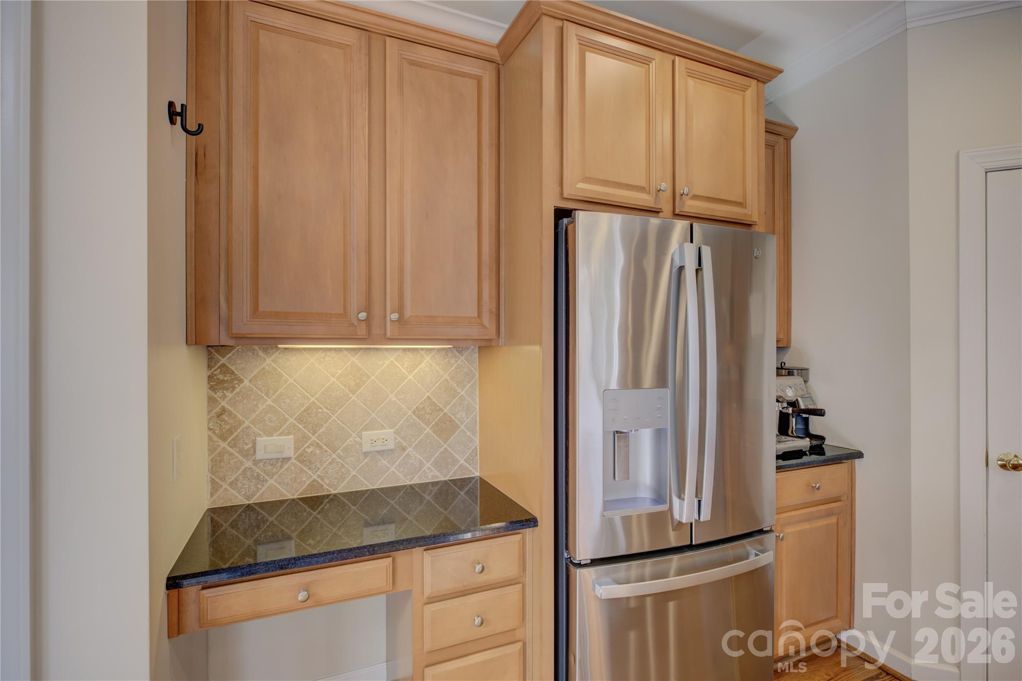 16624 Turtle Point Road Charlotte, NC 28278 - Photo 16 of 46 a kitchen with a refrigerator and cabinets