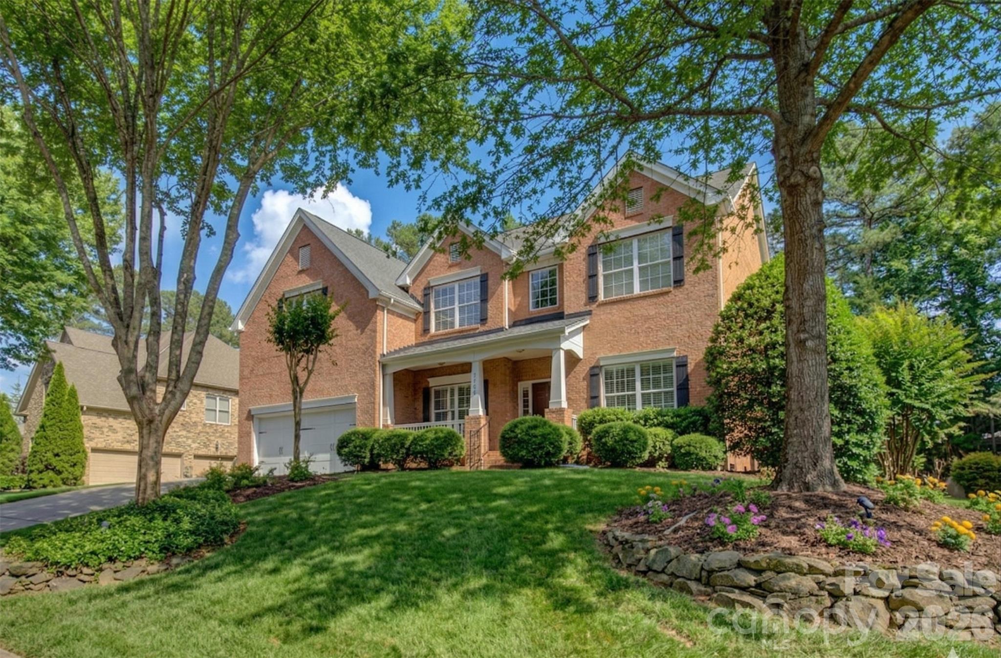 16624 Turtle Point Road Charlotte, NC 28278 - Photo 2 of 46 a front view of a house with a garden