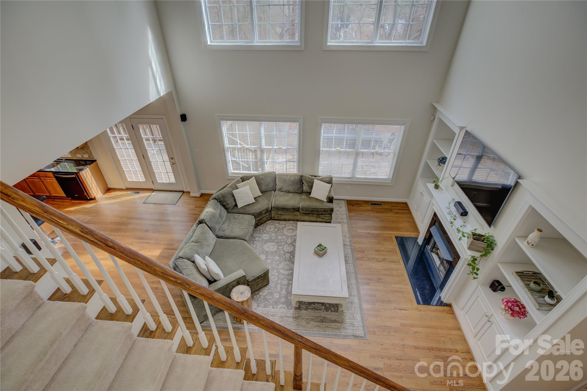 16624 Turtle Point Road Charlotte, NC 28278 - Photo 23 of 46 a living room with furniture and a flat screen tv