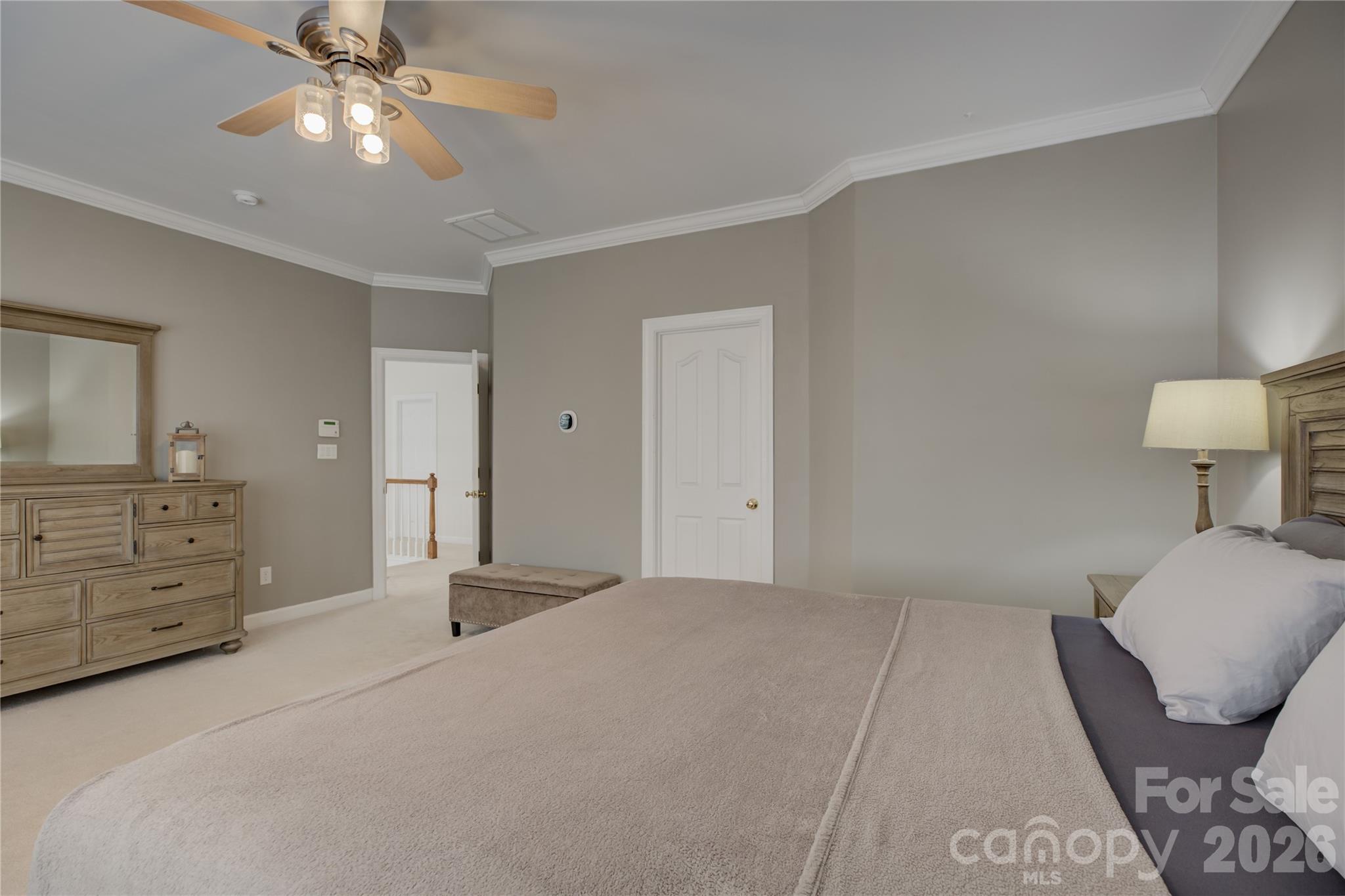 16624 Turtle Point Road Charlotte, NC 28278 - Photo 25 of 46 a bedroom with a bed and a chandelier