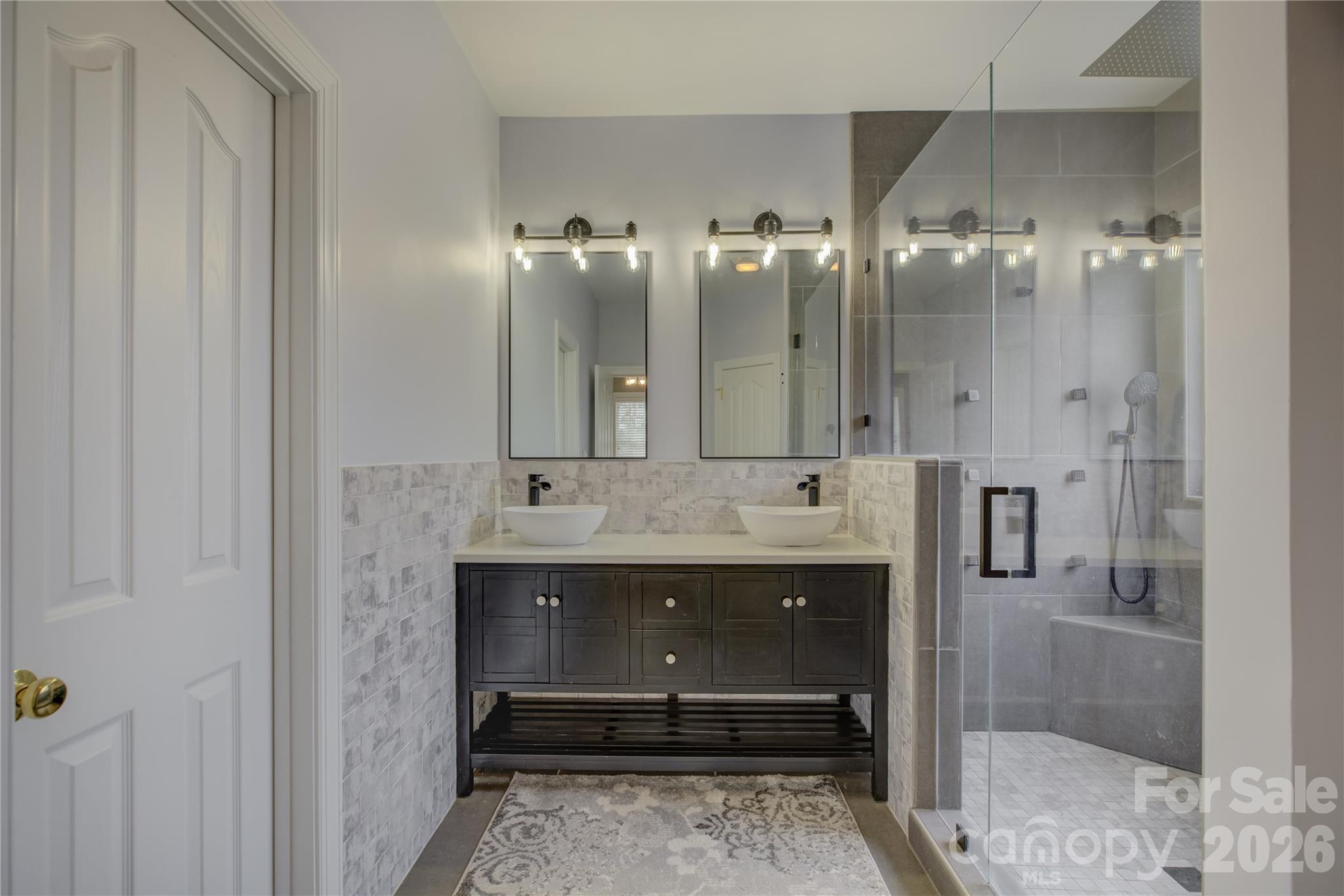 16624 Turtle Point Road Charlotte, NC 28278 - Photo 26 of 46 a bathroom with a sink and a mirror