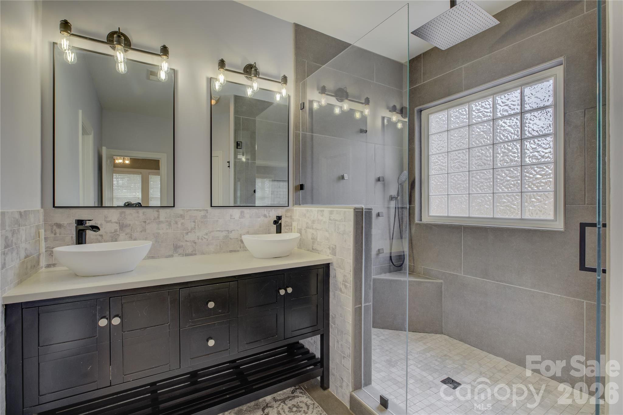 16624 Turtle Point Road Charlotte, NC 28278 - Photo 27 of 46 a bathroom with a double vanity sink mirror and shower
