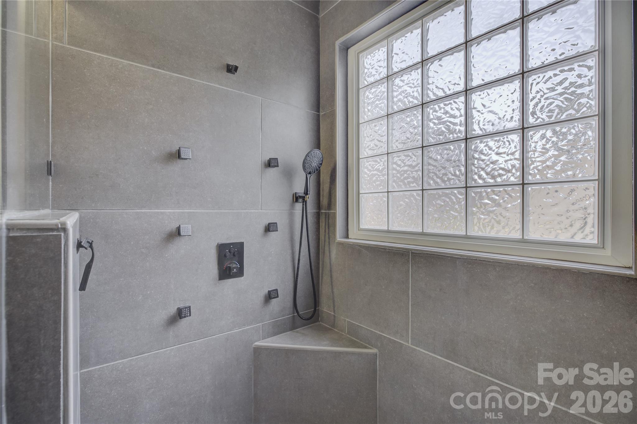 16624 Turtle Point Road Charlotte, NC 28278 - Photo 28 of 46 a bathroom with a bathtub and a shower
