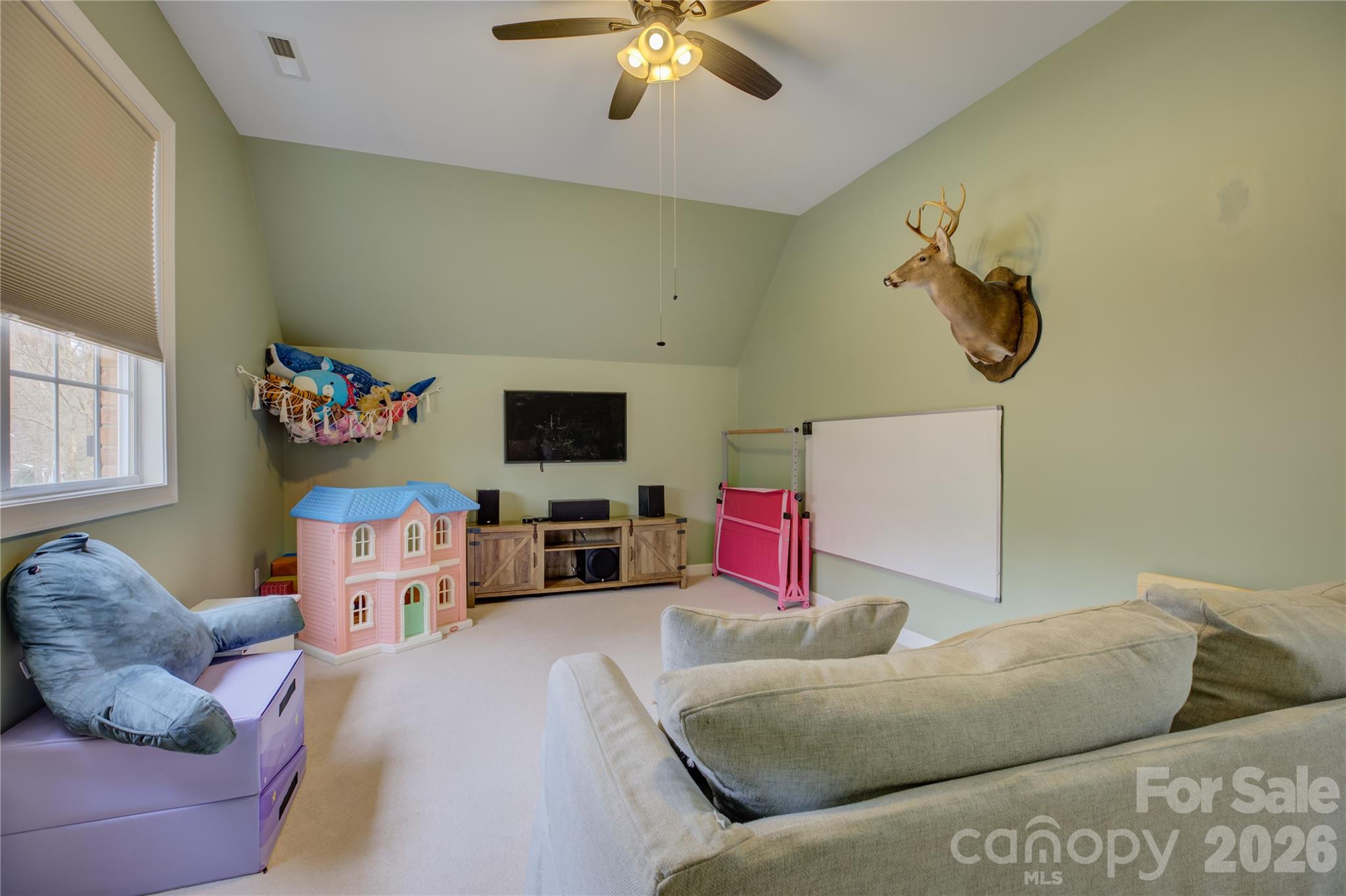 16624 Turtle Point Road Charlotte, NC 28278 - Photo 29 of 46 a living room with furniture and a flat screen tv