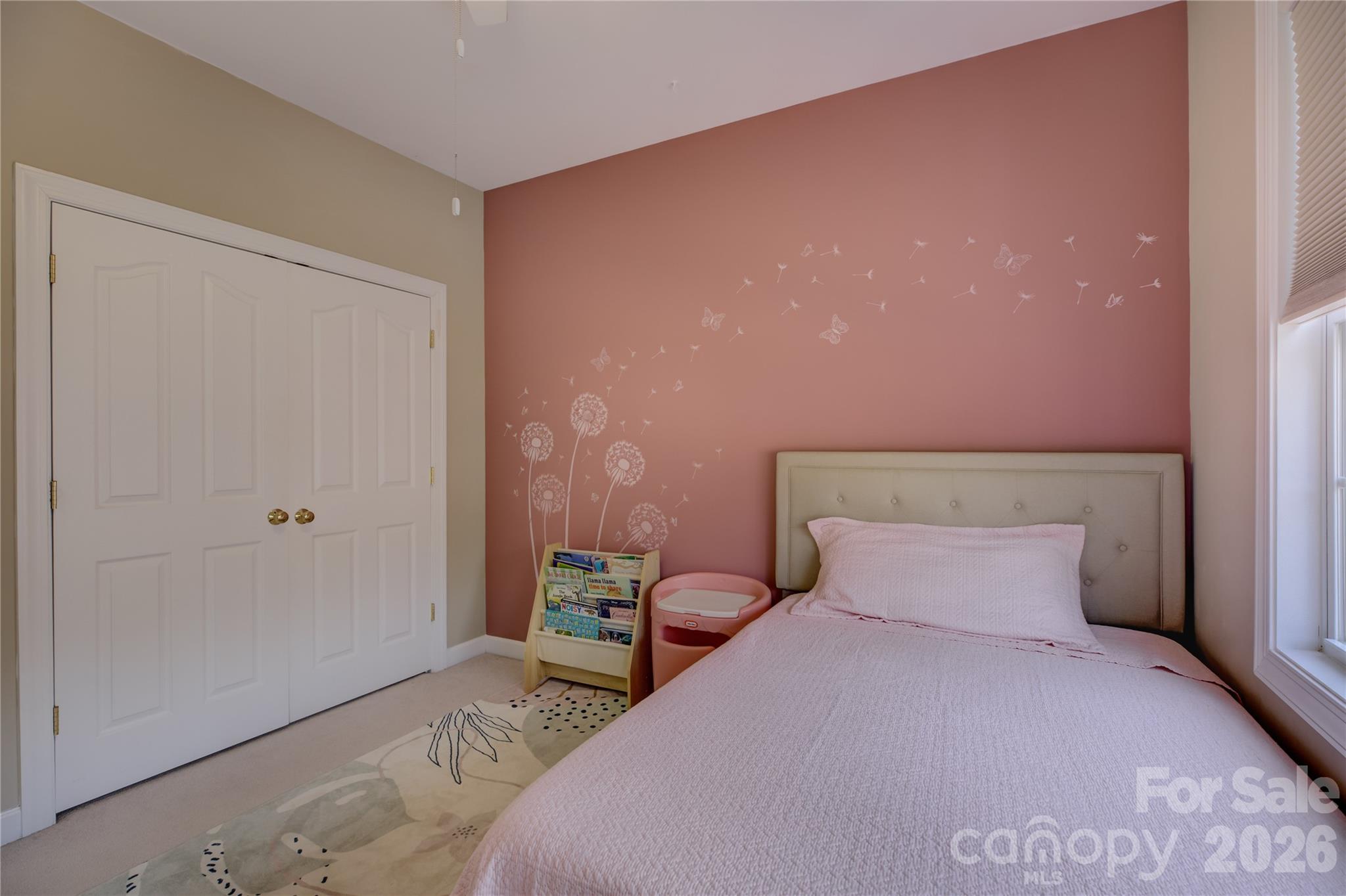 16624 Turtle Point Road Charlotte, NC 28278 - Photo 34 of 46 a bedroom with a bed and a potted plant