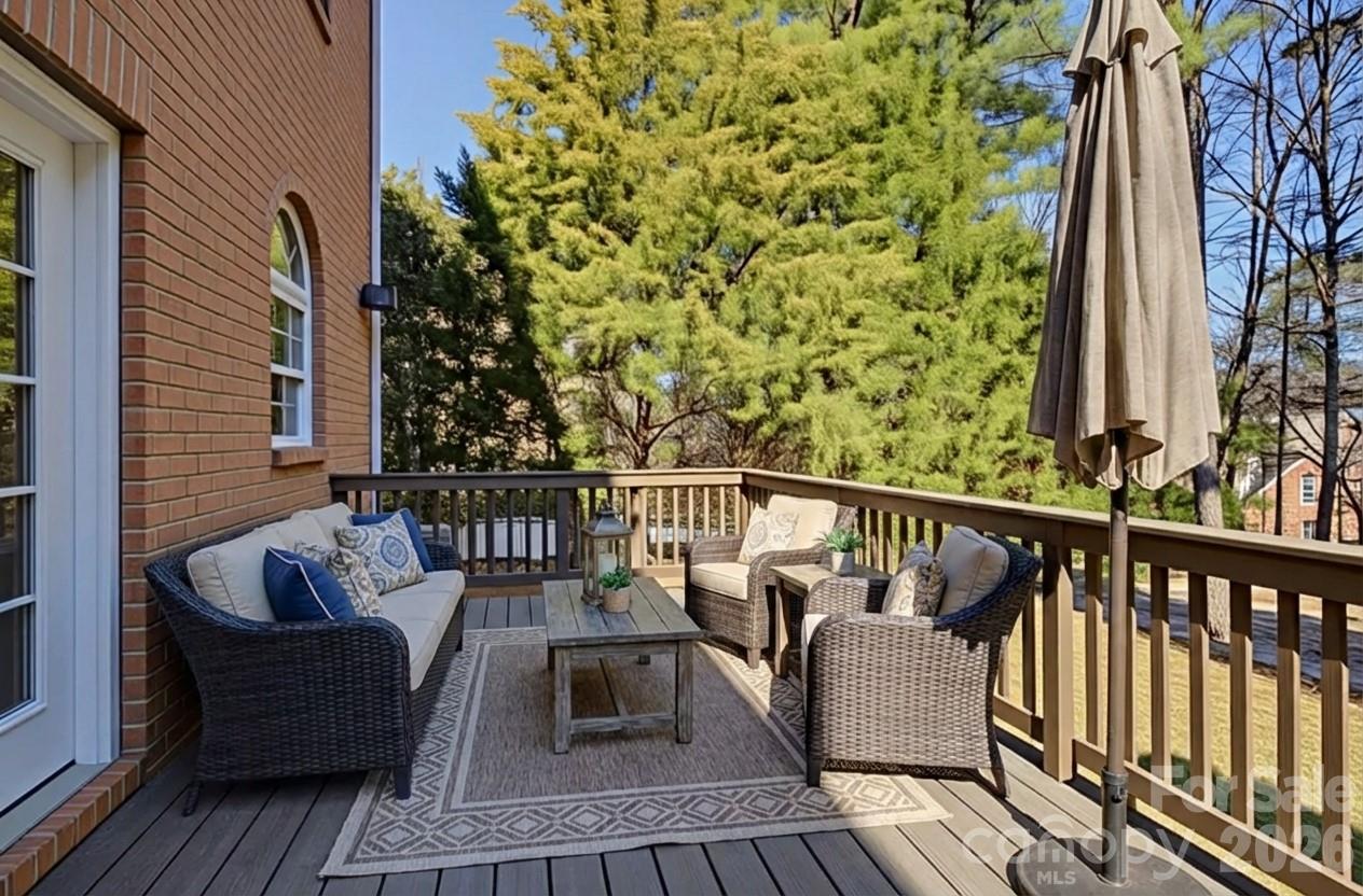 16624 Turtle Point Road Charlotte, NC 28278 - Photo 38 of 46 a balcony with wooden floor and outdoor seating