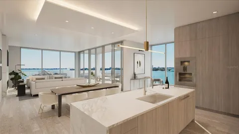 a kitchen with a sink and chairs