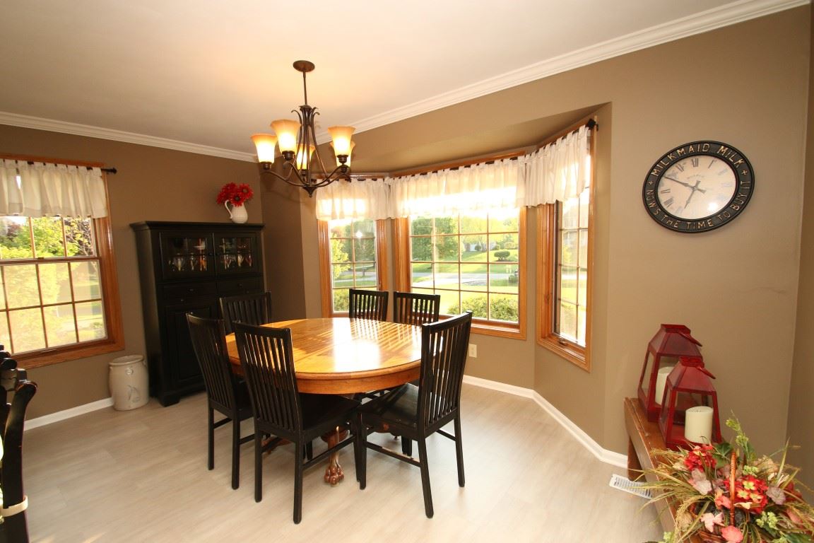 11627 Prestwick Road Belvidere, IL 61008 - Photo 12 of 25 a view of a dining room with furniture window and outside view