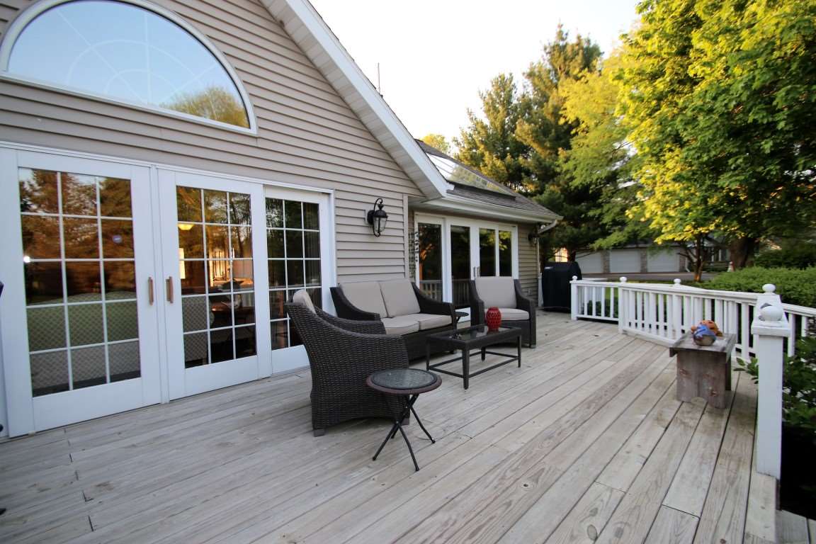 11627 Prestwick Road Belvidere, IL 61008 - Photo 23 of 25 a view of a house with wooden deck and furniture