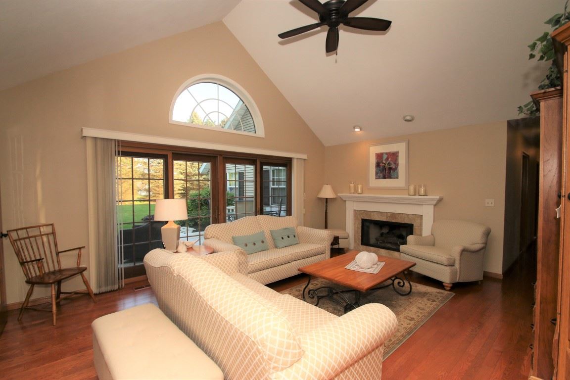 11627 Prestwick Road Belvidere, IL 61008 - Photo 5 of 25 a living room with furniture and a fireplace