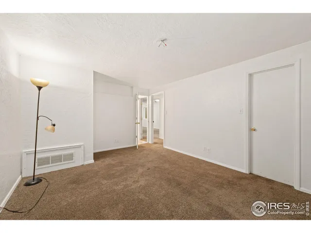 a view of a backyard with plants and outdoor seating