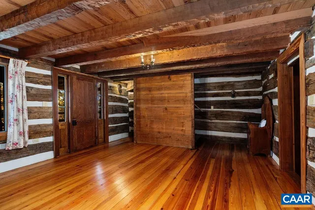 a view of walk in closet with wooden floor