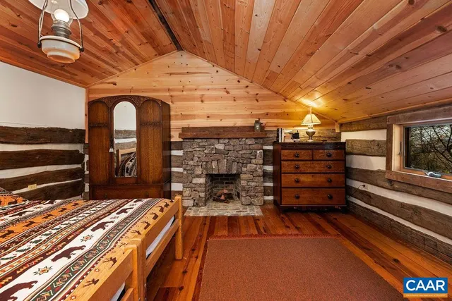 a sitting area with wooden floor