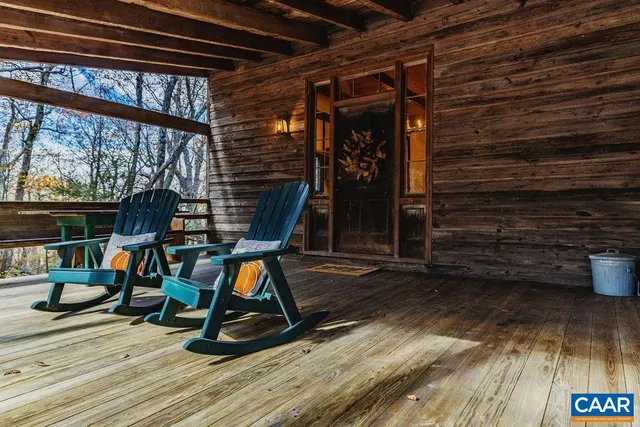 a view of deck with wooden floor and iron stairs