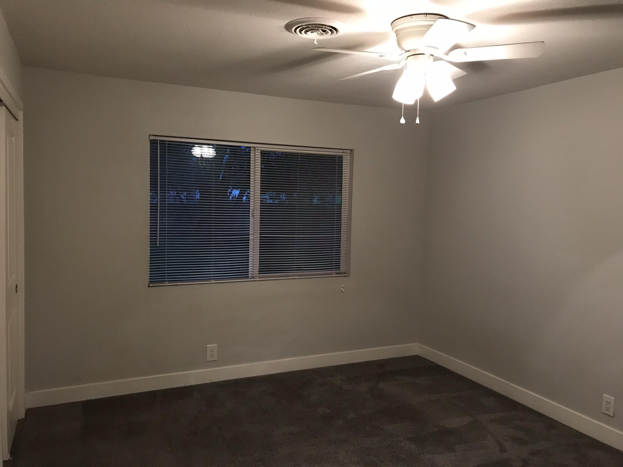 5601 Eastside Road Redding, CA 96001 - Photo 11 of 22 en empty room with windows and fan
