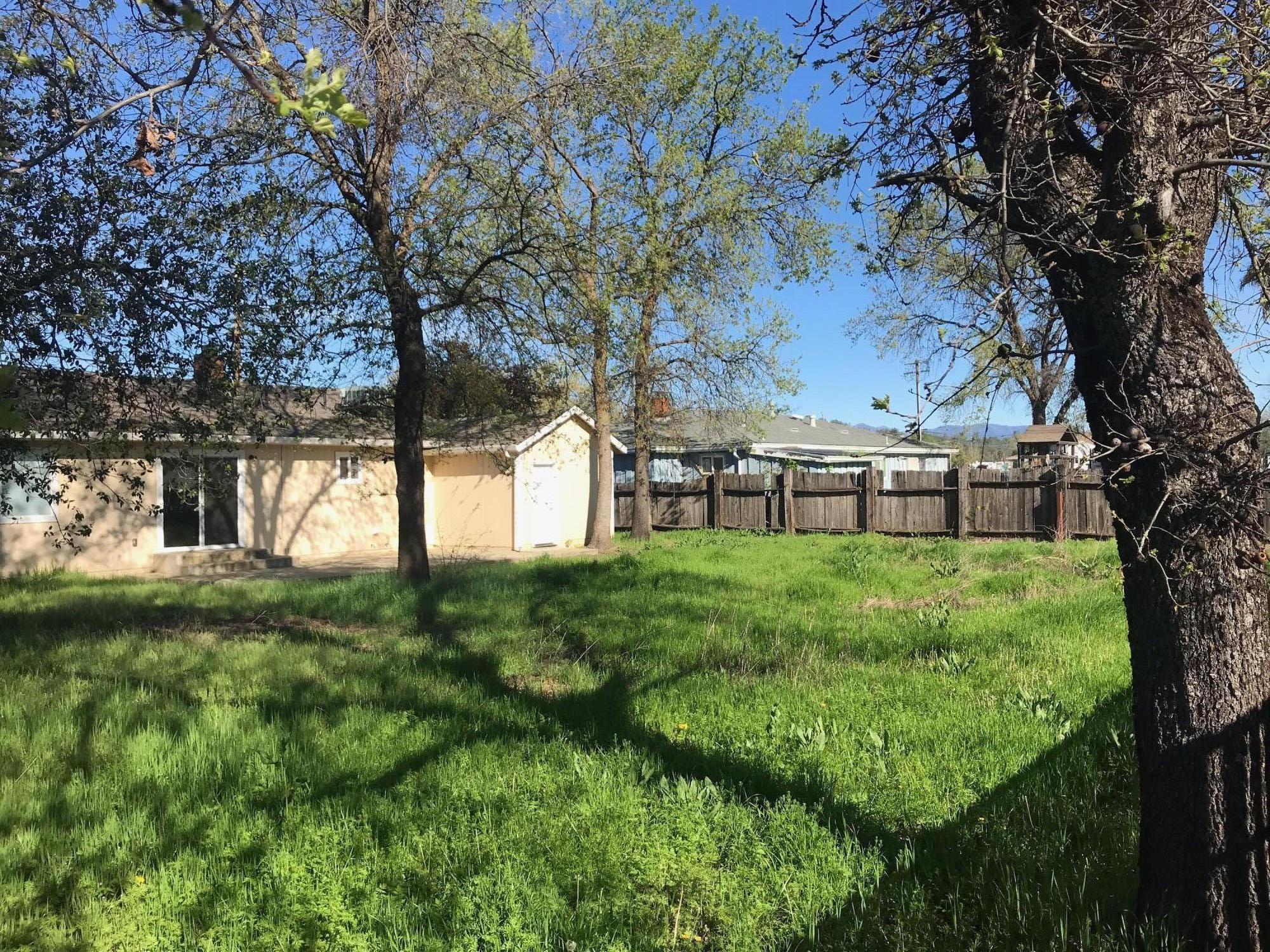 5601 Eastside Road Redding, CA 96001 - Photo 19 of 22 a view of backyard with large trees