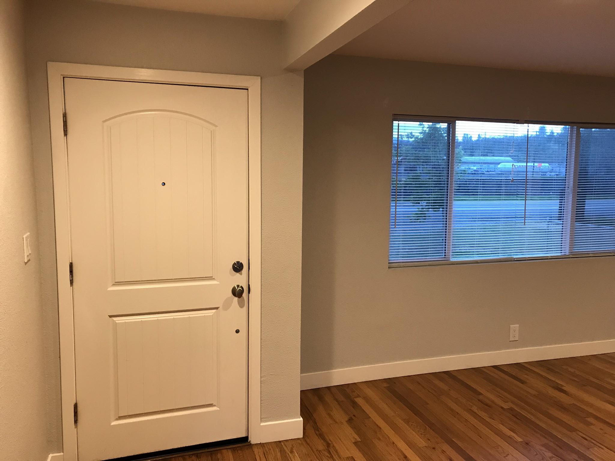 5601 Eastside Road Redding, CA 96001 - Photo 2 of 22 a view of a small space with wooden floor and a window