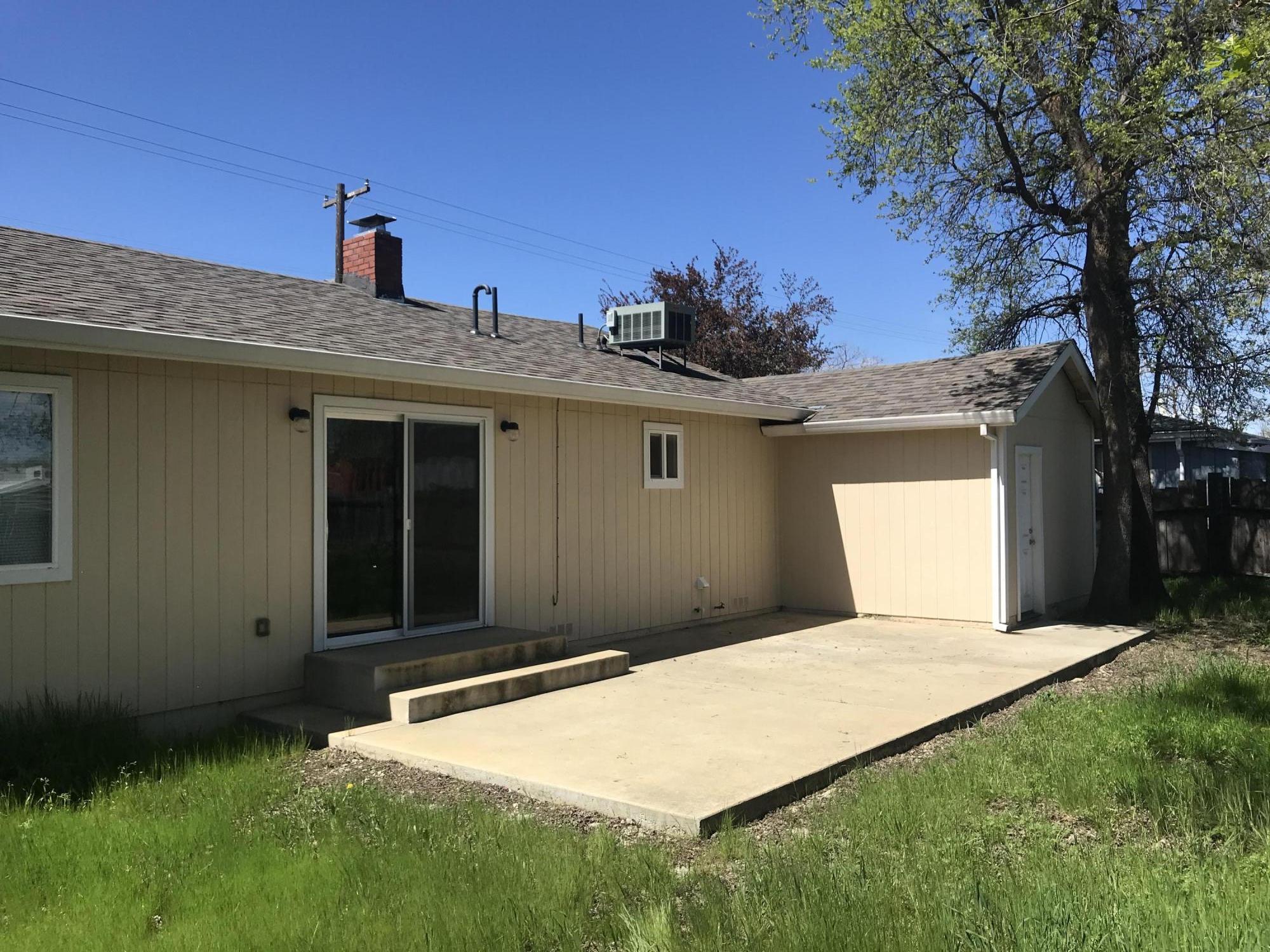 5601 Eastside Road Redding, CA 96001 - Photo 21 of 22 a front view of a house with a yard