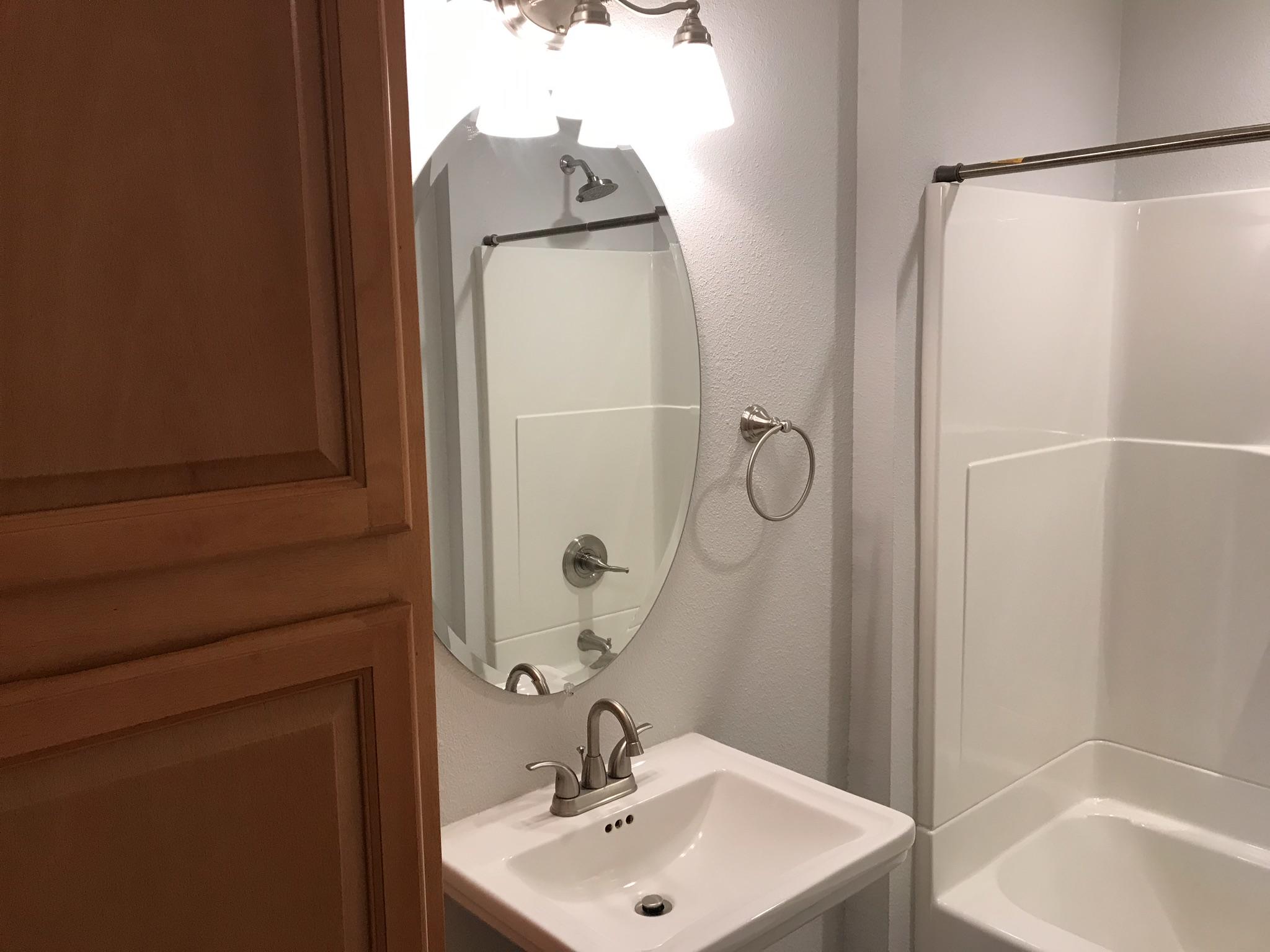 5601 Eastside Road Redding, CA 96001 - Photo 10 of 22 a bathroom with a sink a toilet and shower