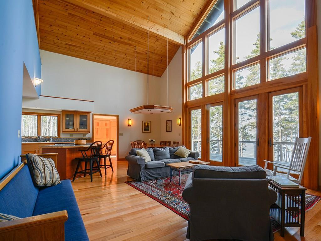 587 Jericho Bay Road Swans Island, ME 04685 - Photo 17 of 33 A west wall of windows provides...