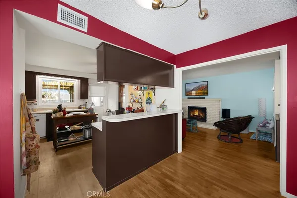 a kitchen with a sink appliances and cabinets