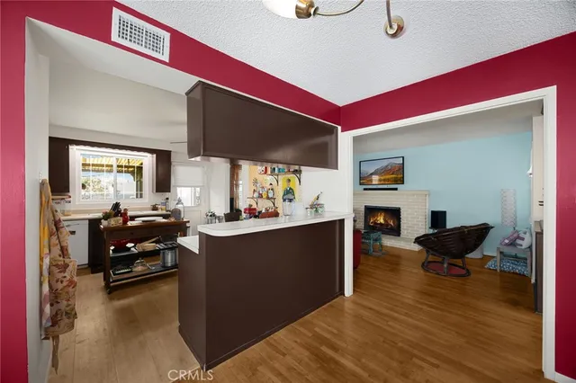 a kitchen with a sink appliances and cabinets