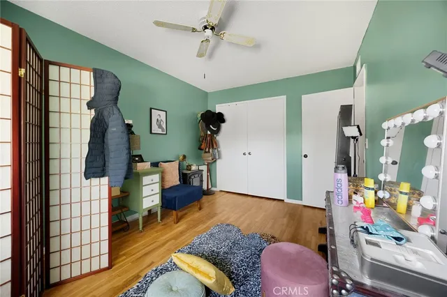 a living room filled with furniture and a window