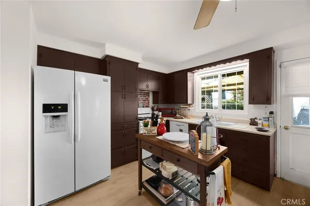 a kitchen with a sink stove and refrigerator