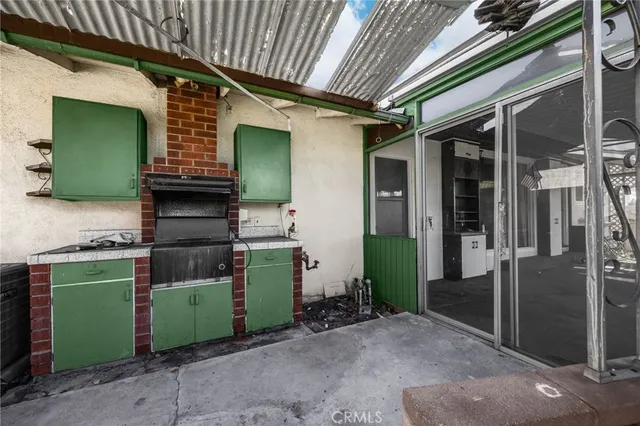 a view of a house with a big yard and potted plants