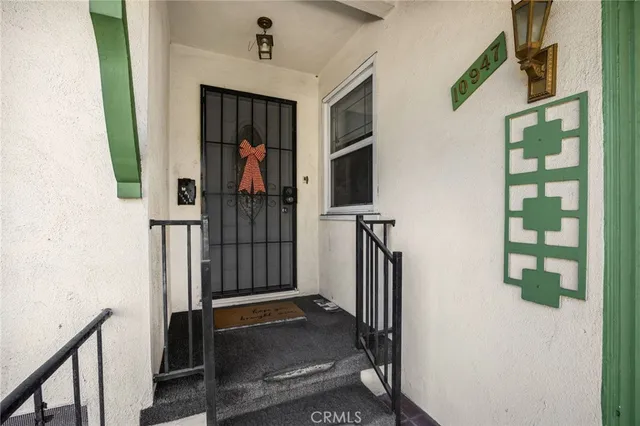 a view of a hallway with paintings on the wall